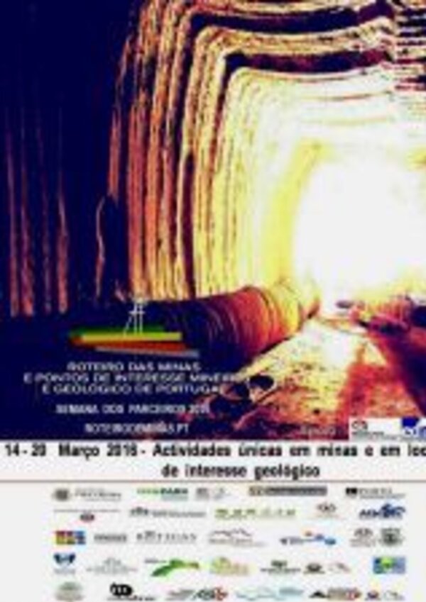 Imagem de uma mina iluminada, com paredes de rocha e um túnel que se estreita.